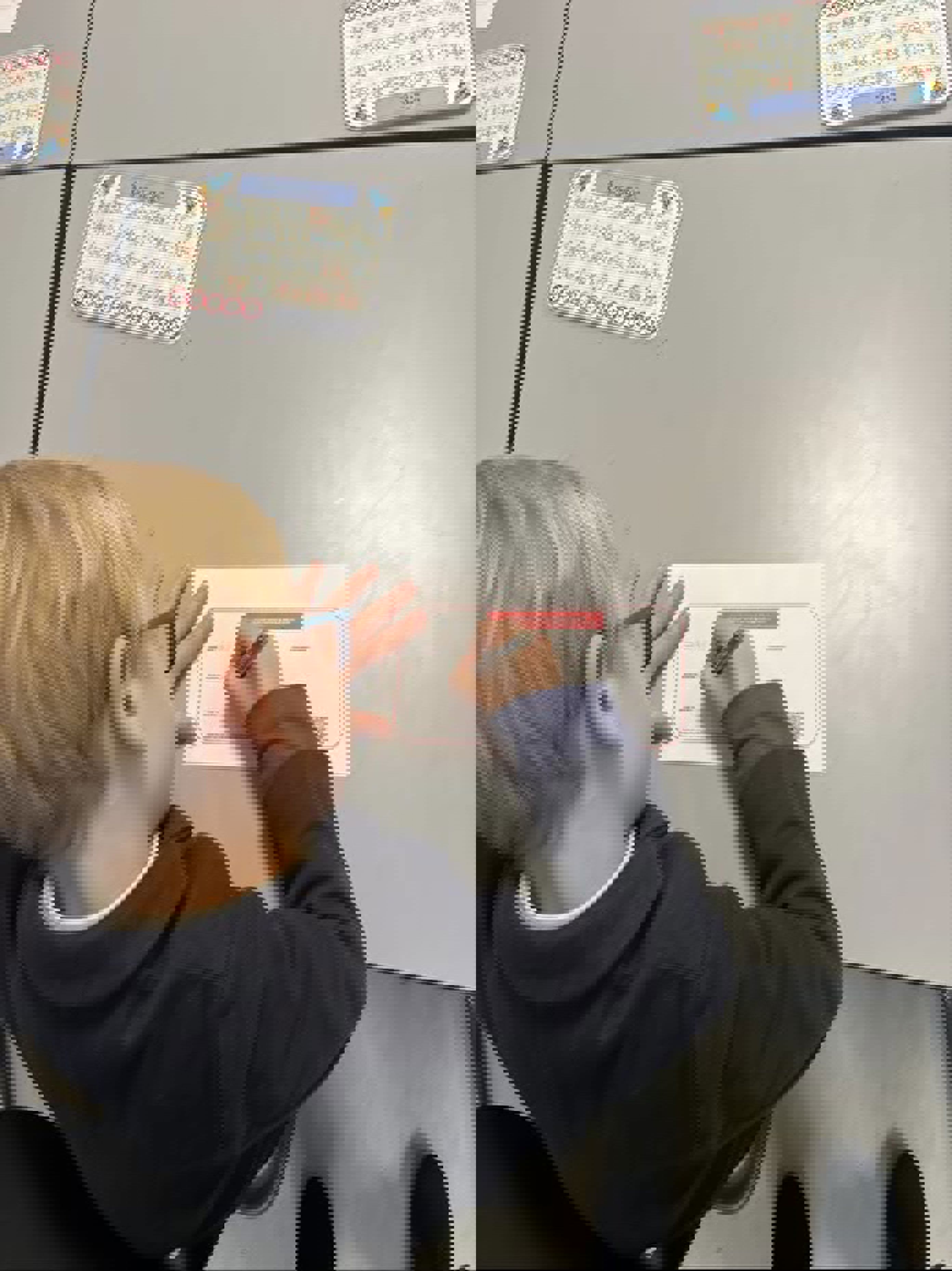 et barn som skriver på en tavle et barn som skriver på en tavle