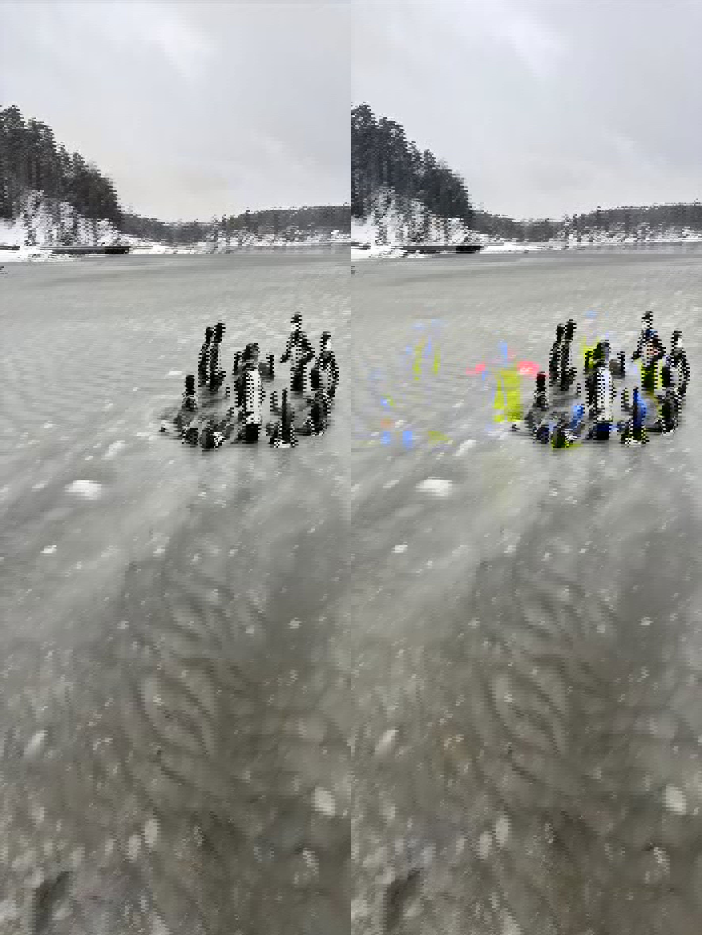 En gruppe mennesker i redningsvester på en frossen innsjø